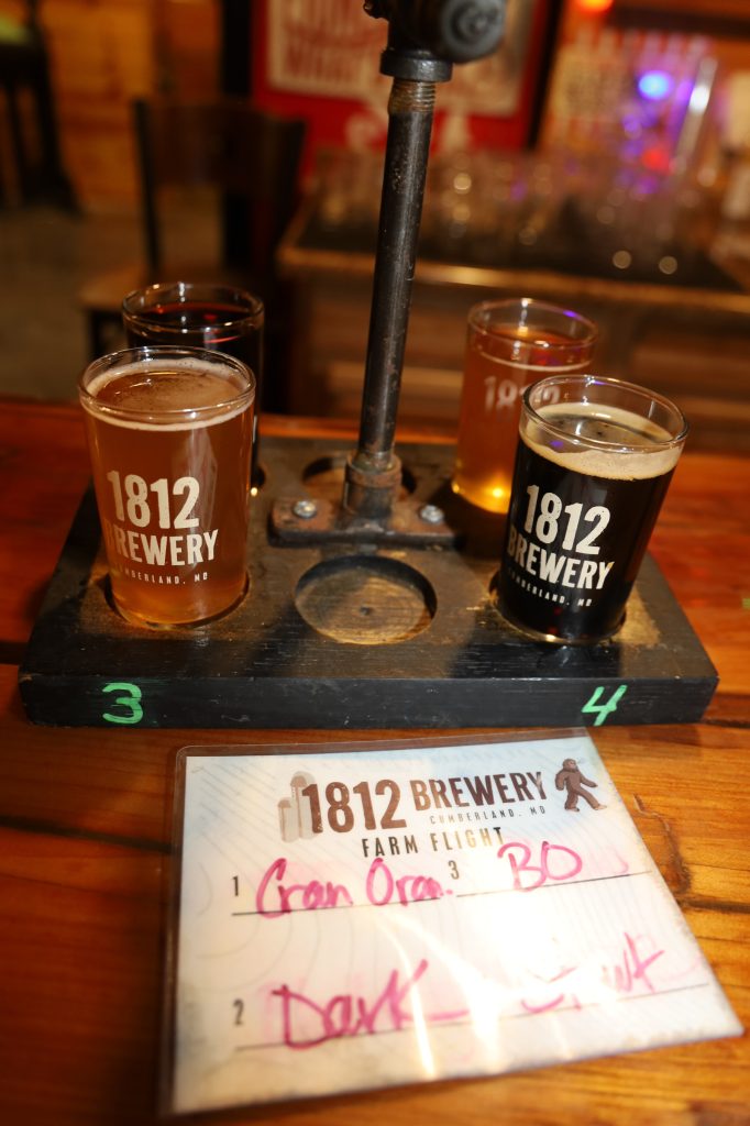 Beer tasting tray with four variations.