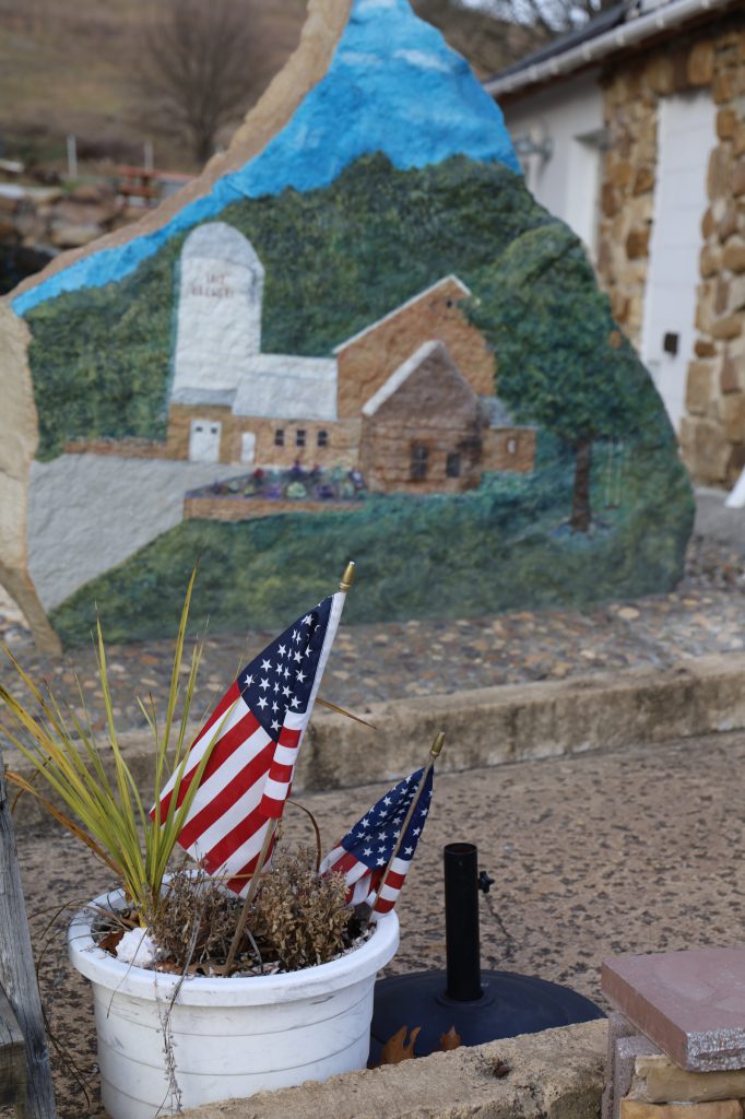 The 1812 Brewery painting on a rock.