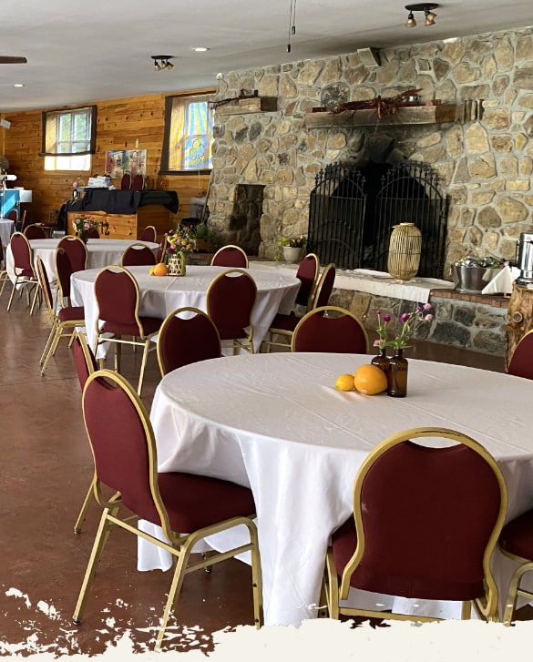 The Loafing Barn tables and chairs set up for a formal event.
